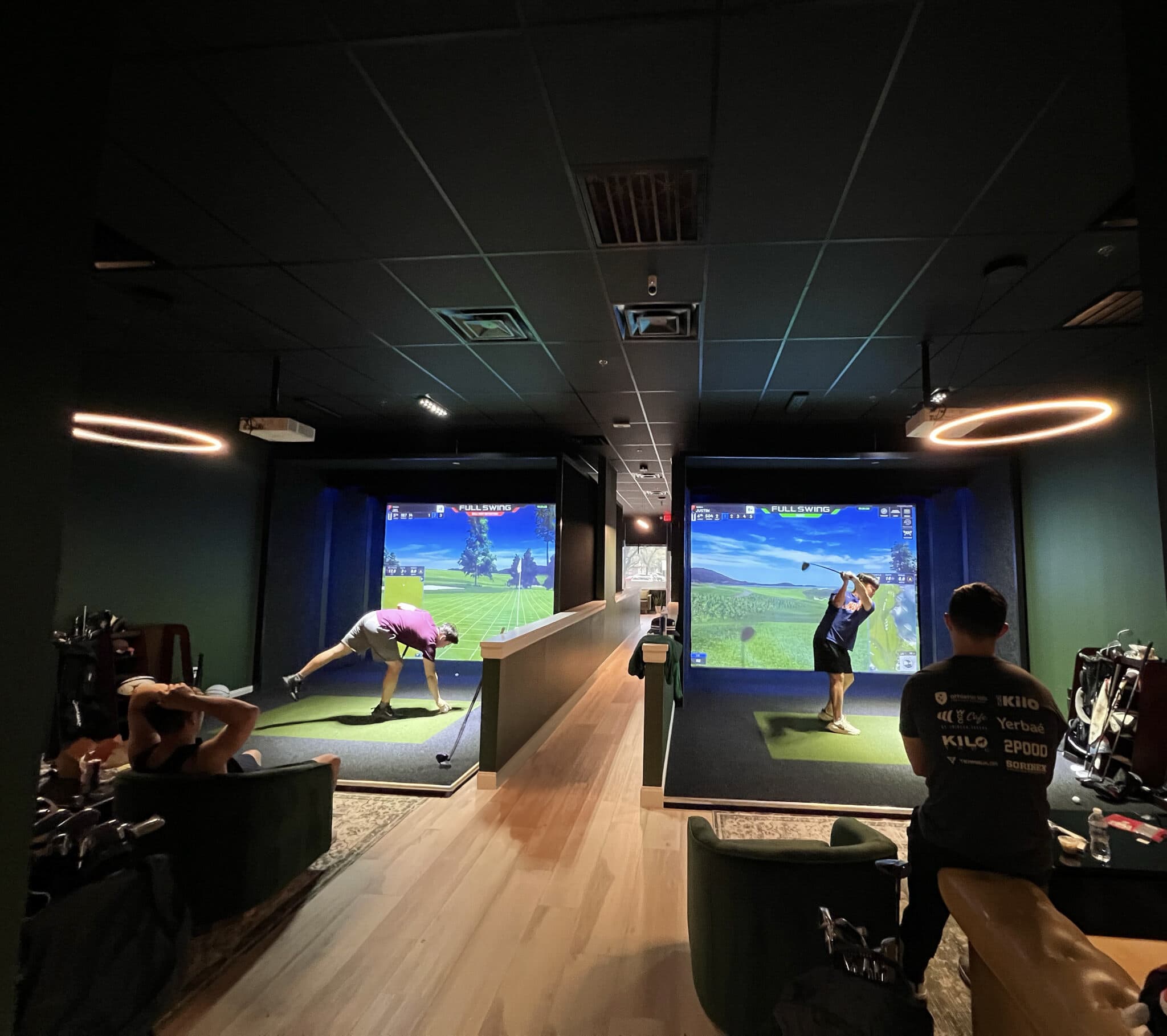 two full swing simulator bays in action